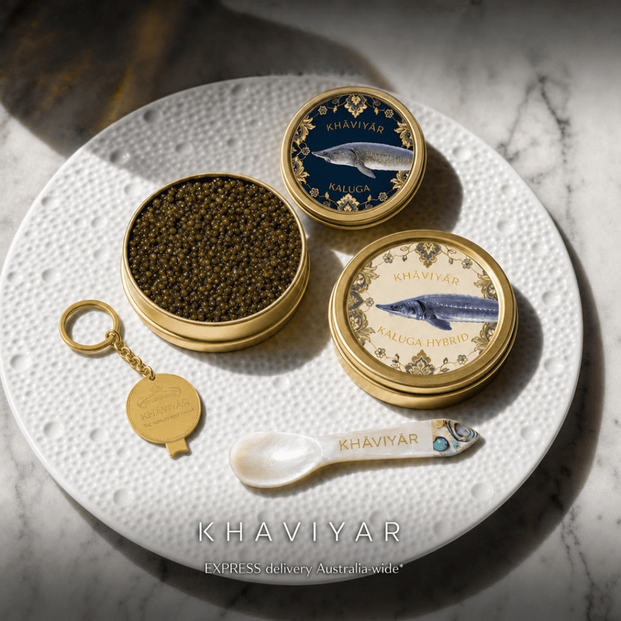 The KHAVIYAR Tasting Set: two tins of Royal-Grade caviar with the complimentary mother-of-pearl spoon and tin opener keychain